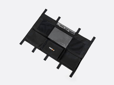 Black multi-compartment Lite Storage Pockets on a white background. - Accessories