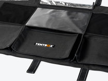 Close up of black Storage Pockets with 'TentBox' logo on a white background.