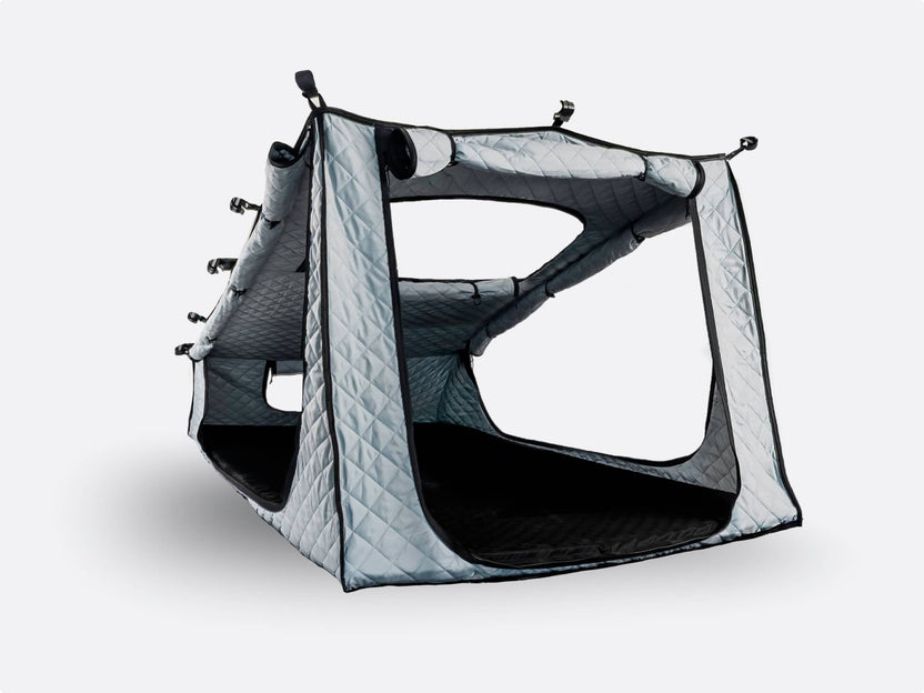 Cut-out shot of the TentBox GO Thermal Kit against a white background, featuring grey quilted fabric, attachments and windows.